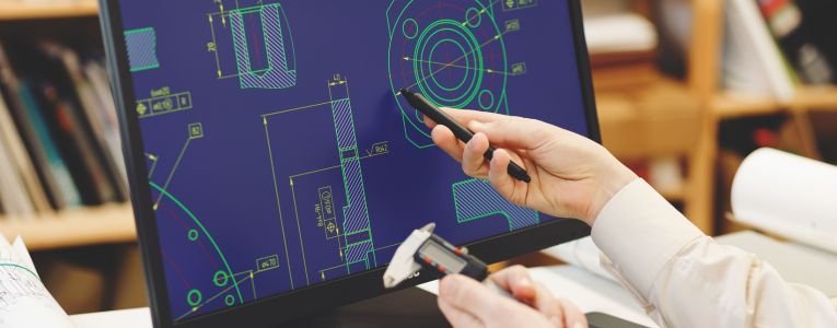 Engineer working on cad scheme using computer tools.