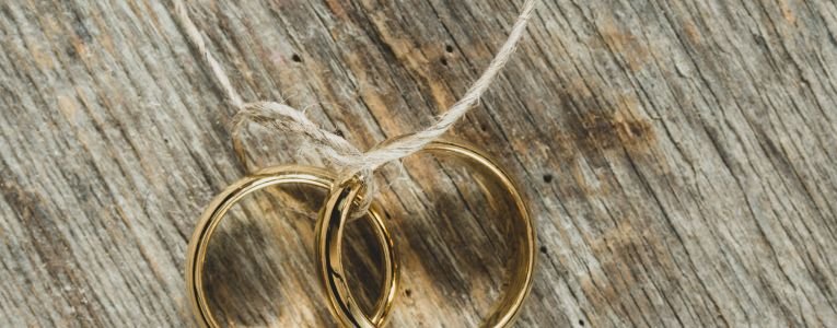 Wedding Concept with Rings on String