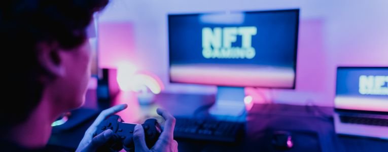 Young gamer having fun playing on decentralized NFT gaming block