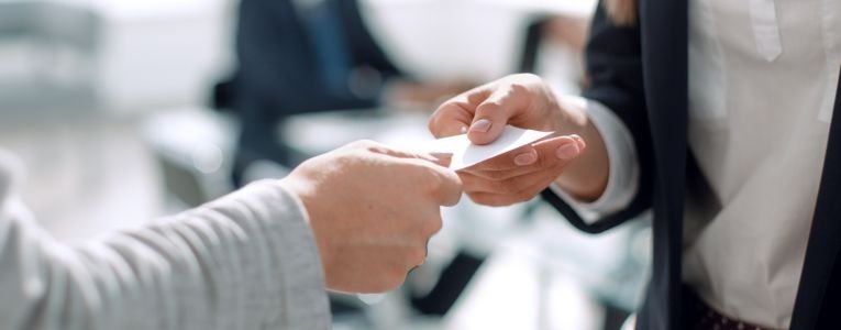 close up.two business woman exchanging business card