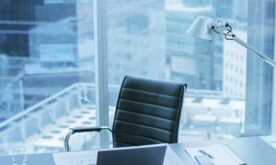 High Angle Shot of a Working Desk of an Successful Person in Office with Cityscape Window View.