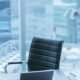 High Angle Shot of a Working Desk of an Successful Person in Office with Cityscape Window View.