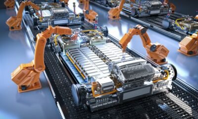 Robot assembly line with electric car battery cells module on pl