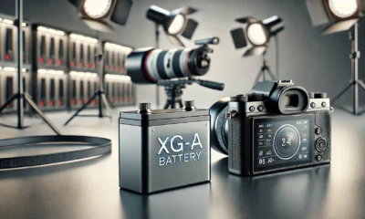 XG-A battery on a workspace with a professional camera setup, highlighting its use in photography and energy storage in a tech-focused environment.